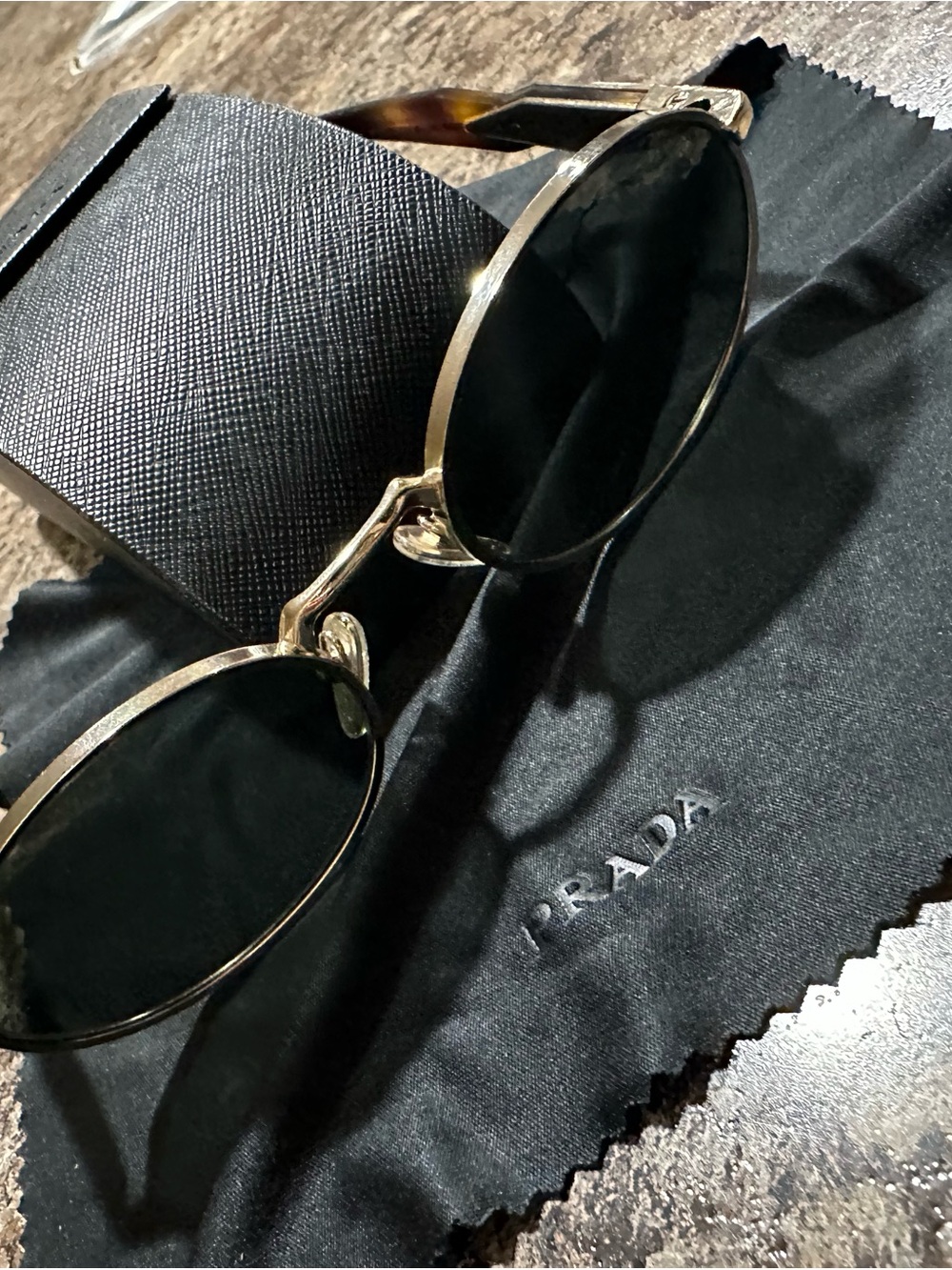 Prada Gold Frame Black Lens Round Sunglasses with Tortoiseshell Temples